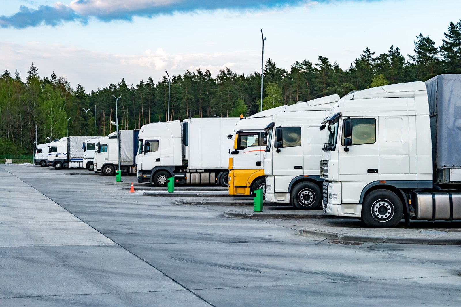 trucks in a row with containers in the parking lot 2024 06 25 00 39 19 utc scaled