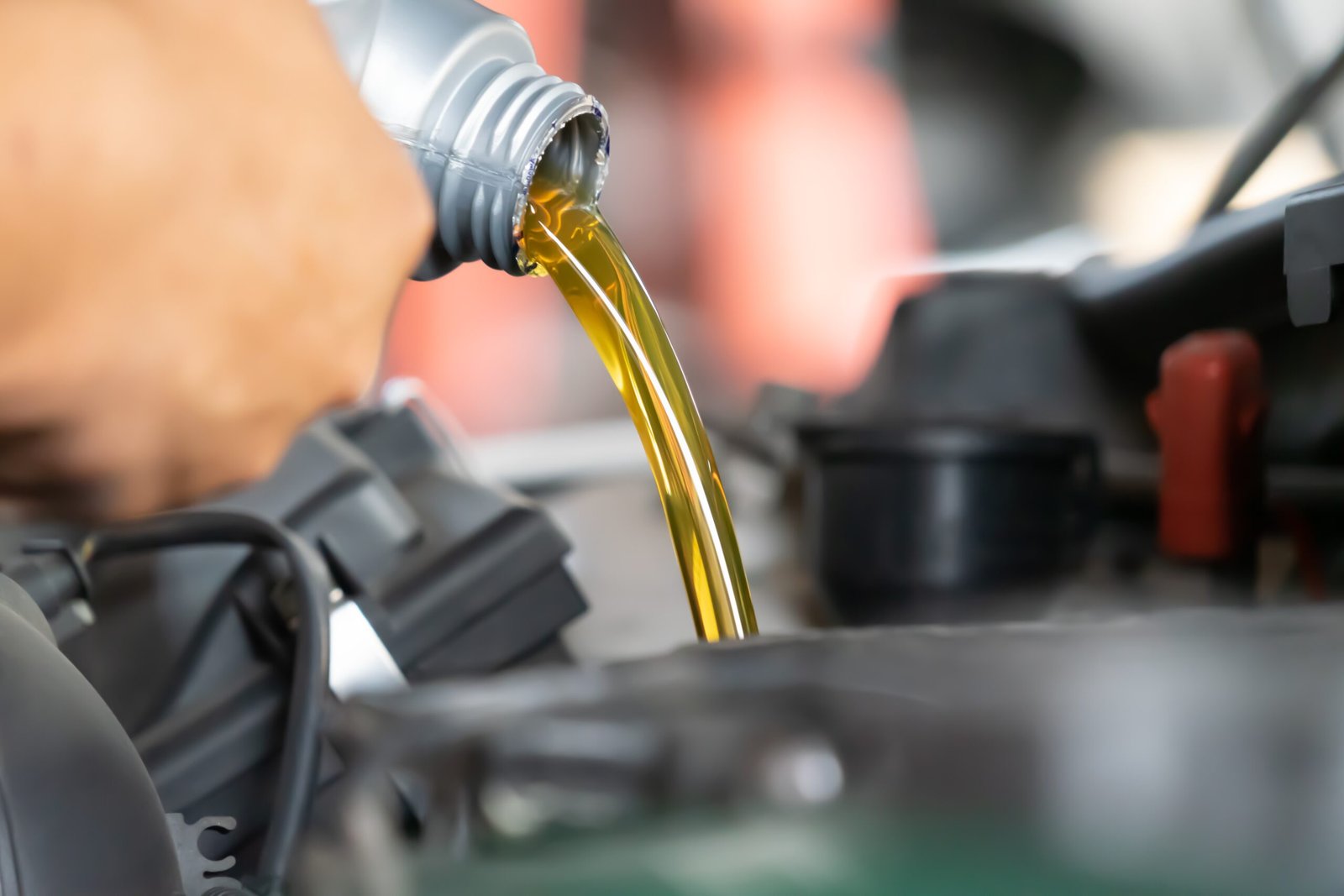 pouring engine oil to car engine fresh oil poured 2024 10 18 06 44 37 utc scaled